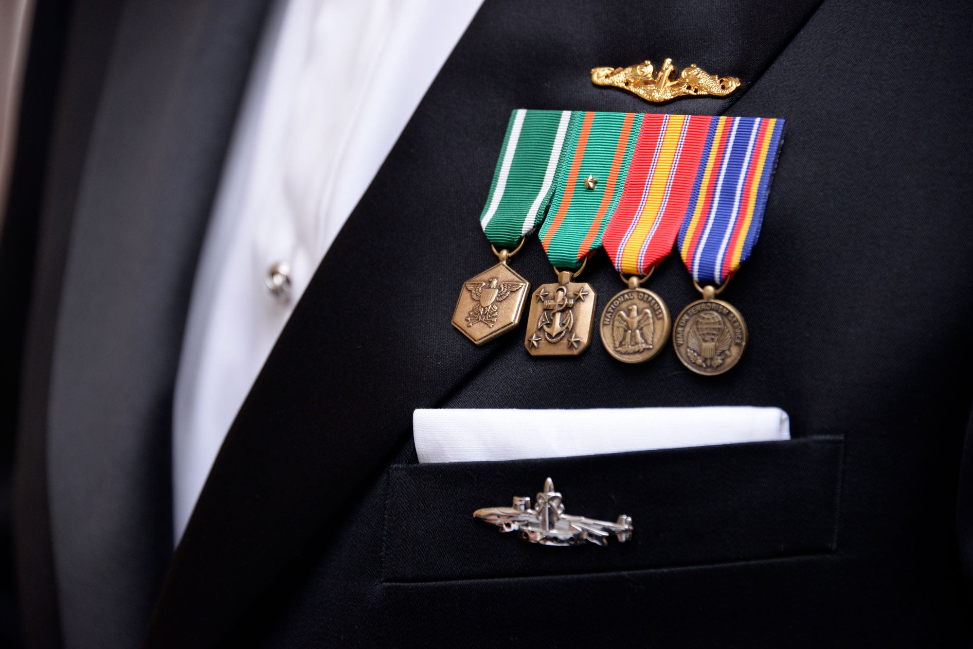 Medals and ribbons on a black suit jacket
